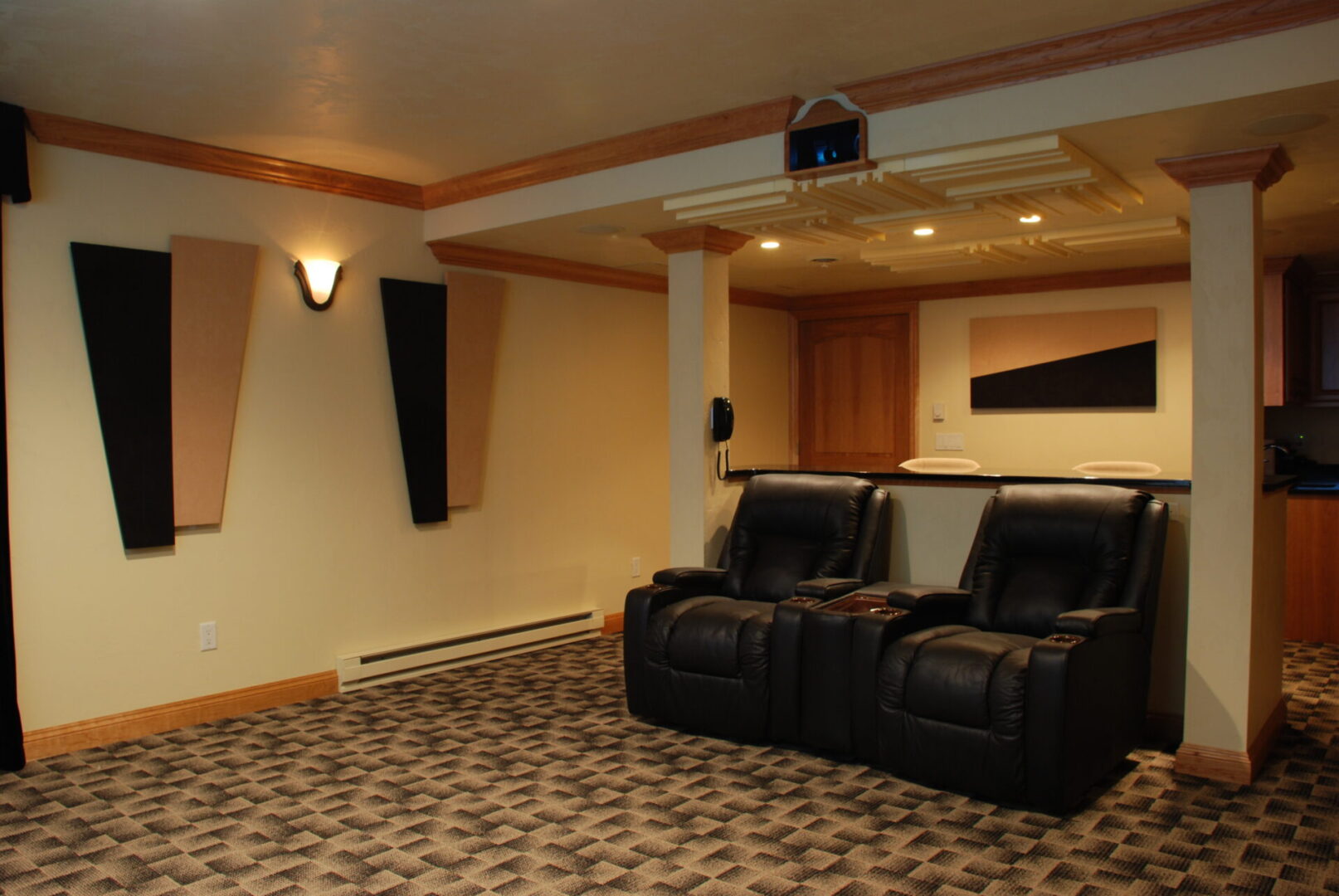 Two-person reclining couch at a home theater